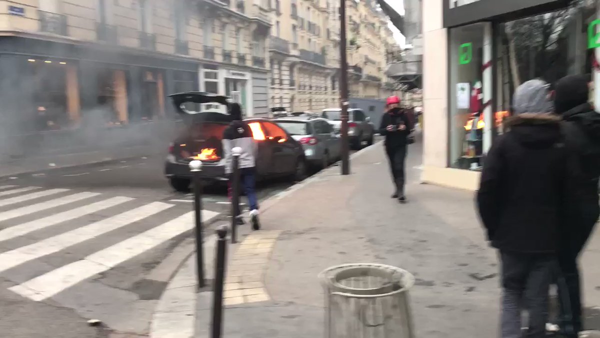 Yellow vests rioters burning cars at  Boulevard de Courcelles in Paris