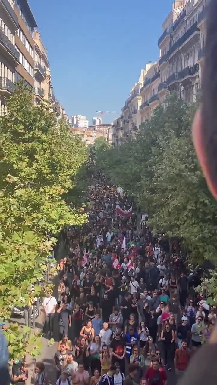 A human tide surges through the streets of Marseille