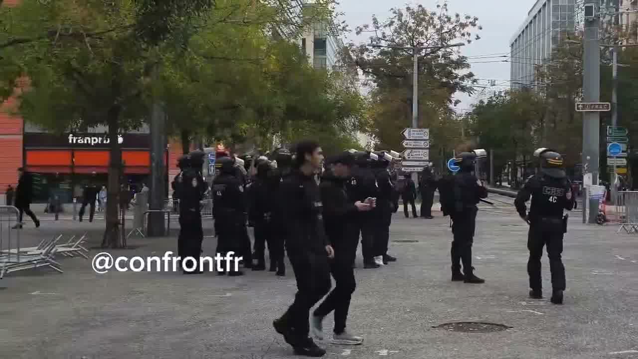 Flames engulf barricade in Marseille's Joliette district.
