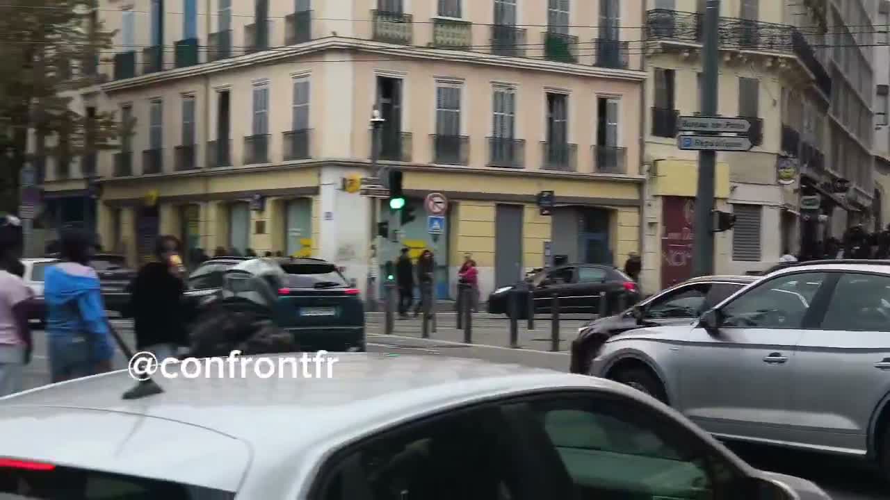 Flames engulf barricade in Marseille's Joliette district.