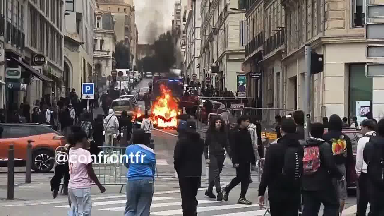 Flames engulf barricade in Marseille's Joliette district.